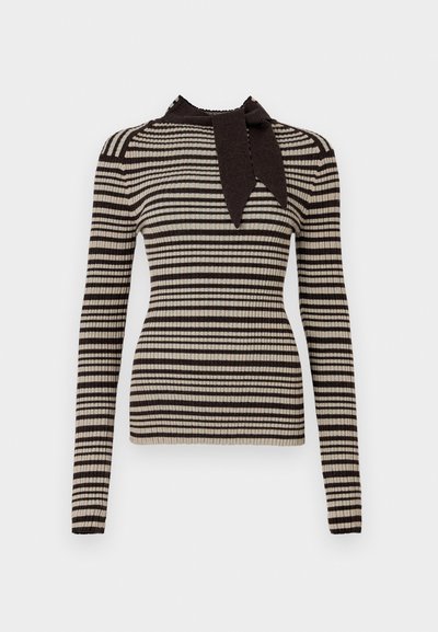 Ριγέ τοπ σε μπεζ και σκούρο καφέ, με κορδόνι στον λαιμό. Μακριά μανίκια και εφαρμοστή γραμμή, με εναλλασσόμενες ζώνες χρώματος.