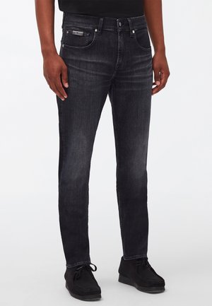 TAPERED - Slim fit jeans - black