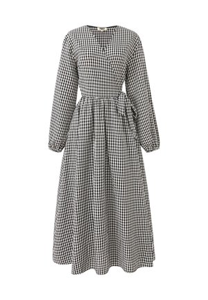 Schwarz-weiße karierte lange ärmellose Midi-Kleid mit V-Ausschnitt, Wickelvorn, gerafftem Taillenbund und seitlichem Bindedetail.