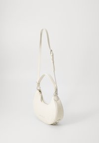 White vegan leather shoulder bag, curved shape, embossed logo pattern, adjustable strap, silver hardware accents, side zipper closure.