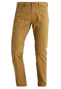 Beige bomullsbyxor med klassisk femficksdesign, smal passform, sydda detaljer och metallknapp vid midjan.