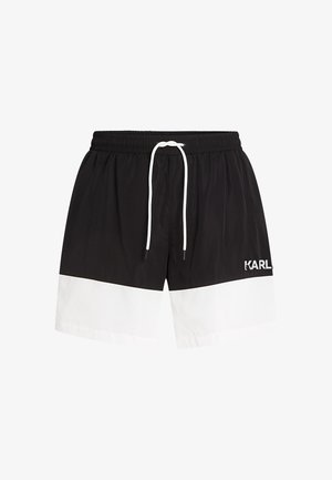 Black swim shorts with a white horizontal stripe, elastic waistband with a white drawstring, and "KARL" logo on the left side.