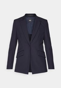 Navy blazer made of textured fabric, featuring a single-button closure, two front pockets, and notched lapels. Interior is lined.