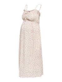 Robe maxi de maternité blanche sans manches avec imprimé floral rose et bretelles spaghetti réglables sur un fond uni.