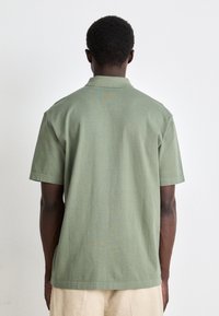 BOSS DYE - Polo majica - open green
