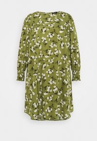 Abito floreale verde con scollo rotondo, maniche lunghe con polsini arricciati e vestibilità comoda. Fiori bianchi e foglie verde scuro sono disposti su tutta la superficie.