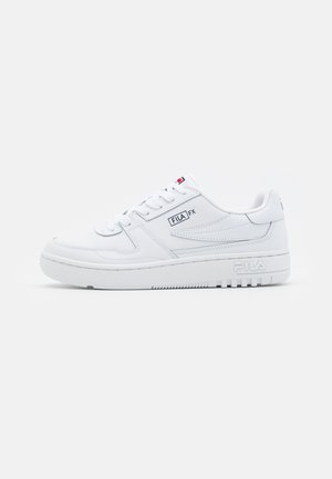 White low-top sneakers made of smooth synthetic material. Features subtle stitching, lace-up design, and branded accents on the side and tongue.