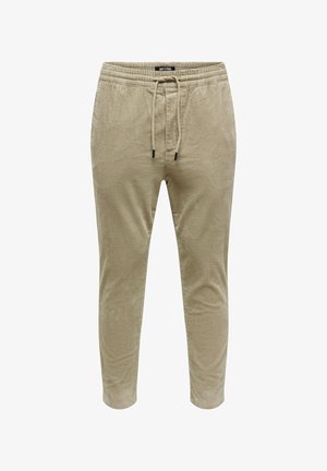 Beezid vahepeal vabaaja püksid elastse vöökohtaga, reguleeritava nööriga ja kitsenevate säärtega. Kangas on pehme ja tekstureeritud ribakattega.