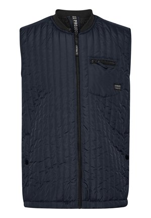 Gequilte marineblauwe vest met hoge kraag, rits aan de voorkant en een borstzak. Heeft zijzakken en een textuurdesign in de stof.