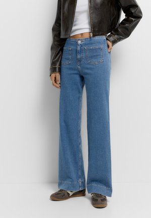 WITH PATCH POCKETS - Wide leg - blue denim