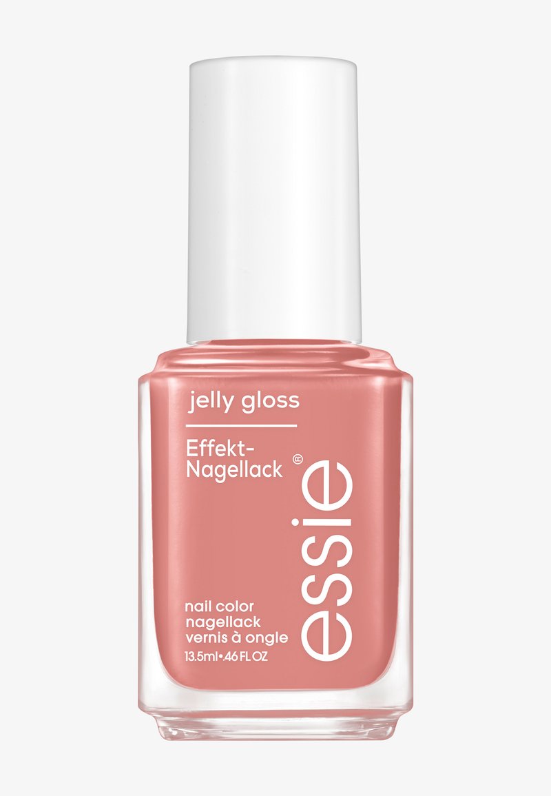 Essie jelly gloss nagellack i en mjuk korallnyans, klar glasflaska med ett vitt lock, har text på etiketten på flera språk.