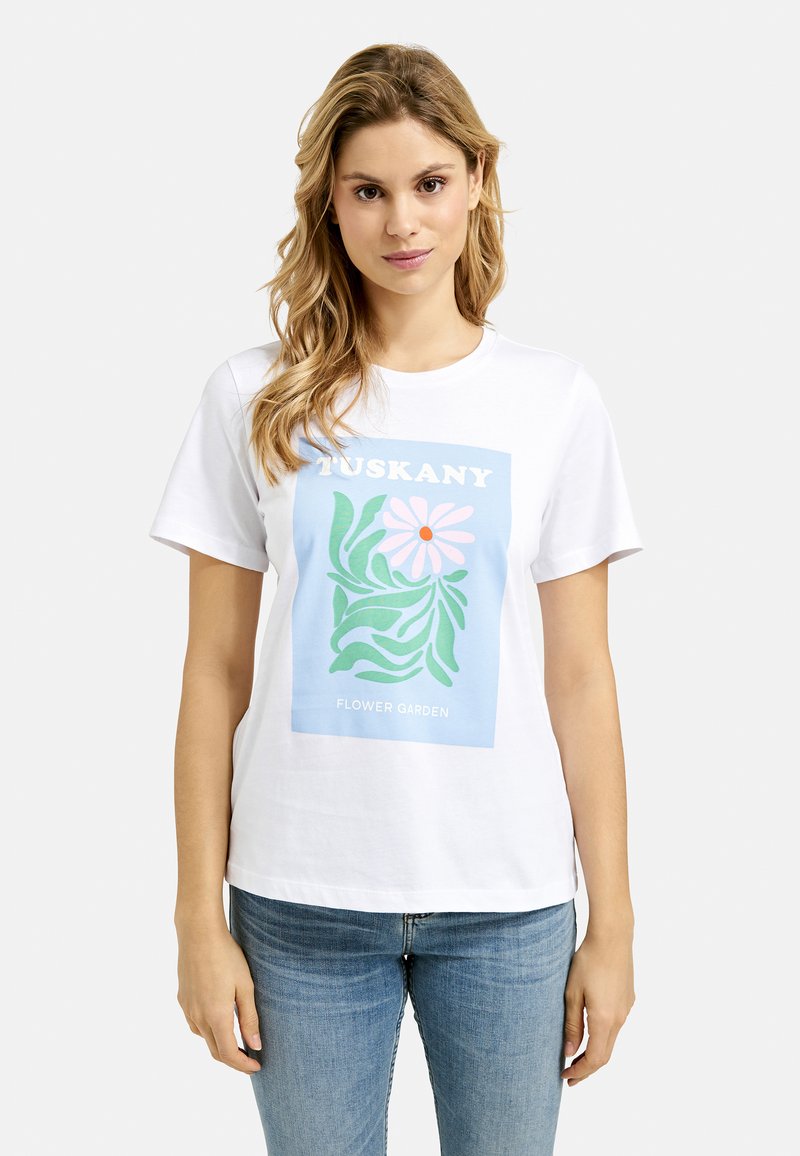 White cotton t-shirt featuring a blue rectangular graphic with floral design and text "TUSKANY FLOWER GARDEN" in white and pink.