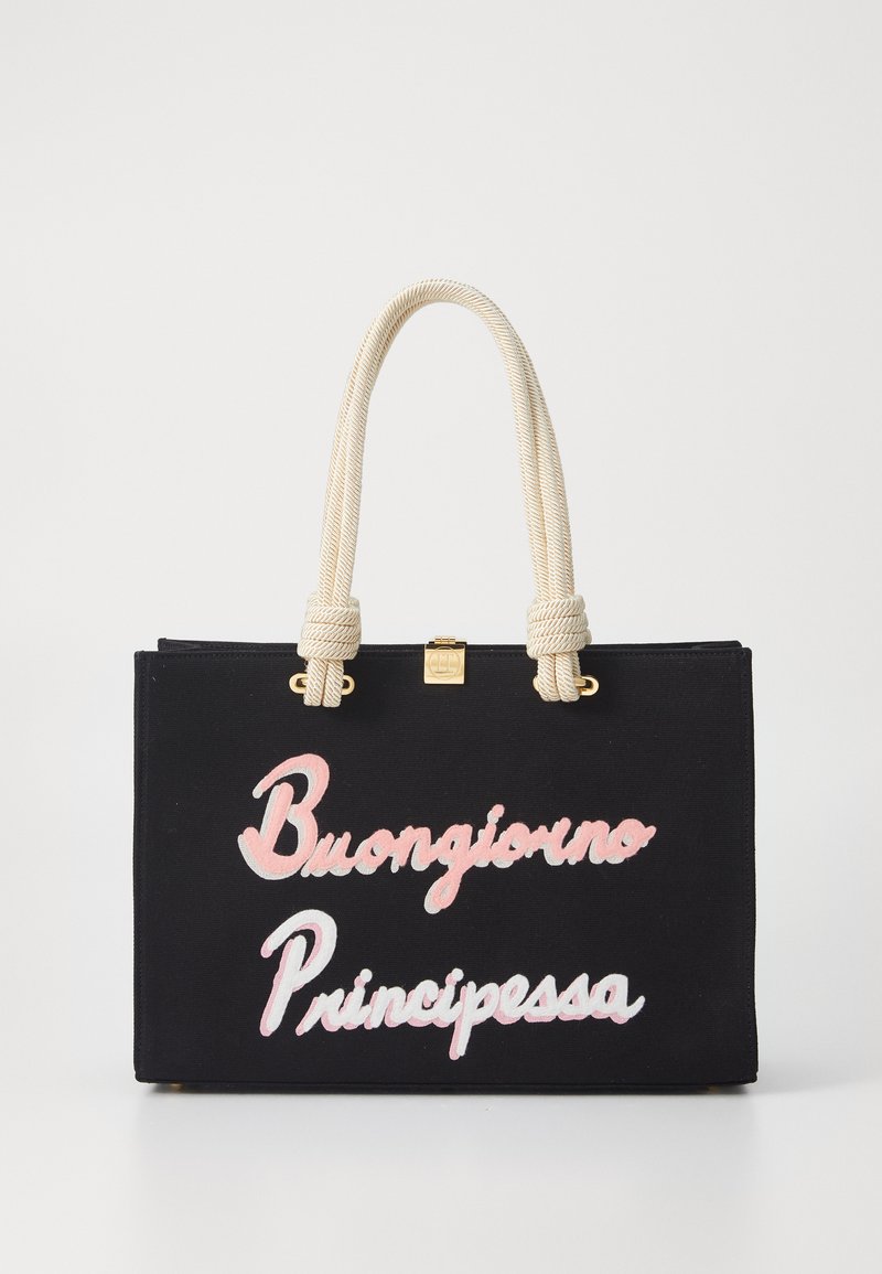 Black canvas tote bag with cream rope handles, featuring the embroidered text "Buongiorno Principessa" in pink and white. Gold accents included.