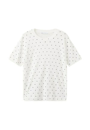Wit shirt met korte mouwen, zwarte stippen, ronde halslijn en een rechte zoom.