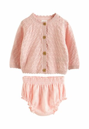 Pink knitted baby cardigan with wooden buttons paired with matching pink ruffled bloomers featuring eyelet details.