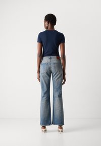 Tommy Jeans CLEO - Bootcut jeans - denim dark