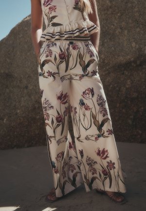Next, REGULAR FIT - PALAZZO WIDE LEG TROUSERS  . - Pantaloni - white green tulip print