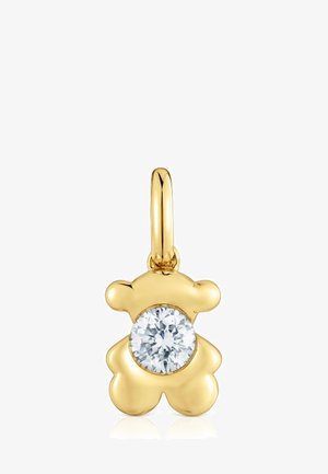 Pendentif en forme d'ours en or orné d'une grande pierre précieuse ronde et transparente au centre. Surface lisse avec une finition polie.