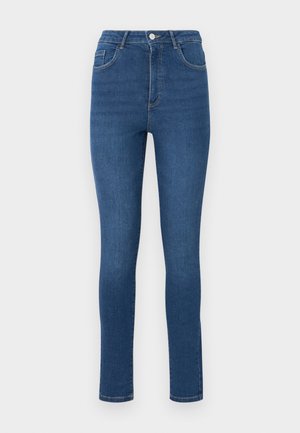 Skinny jeans made of dark blue denim with a high waist, five pockets, and subtle stitching details. The fabric appears smooth and slightly stretchy.