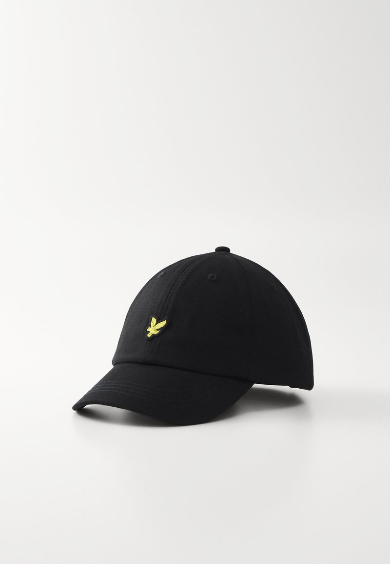 Black baseball cap made of fabric with a curved visor. Features yellow embroidered logo on the front and six ventilation eyelets.