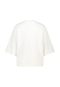Plain white oversized short-sleeve shirt shown from the back with a round neckline and a straight hem.