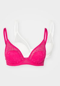 Set of two bras: one pink with lace overlay and thin straps, the other plain white with smooth texture and adjustable straps.