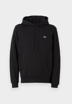 Čierna bavlnená mikina s predným klokankovým vreckom, nastaviteľnou kapucňou so šnúrkou, rebrovanými manžetami a malým zeleným vyšitým logom.