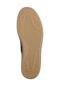 Suola in gomma con un motivo ondulato, di colore beige e dalla superficie liscia. Chiaramente contrassegnata con la taglia e il marchio.