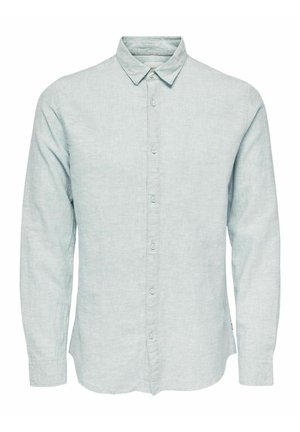 Light blue long-sleeve button-up shirt made of a textured fabric. Features a classic collar and subtle button details along the front.