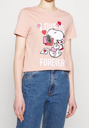 Pink short-sleeve cotton t-shirt featuring a cartoon Snoopy holding letters, with text "LOVE IS FOREVER" in white. Cropped design, casual fit.
