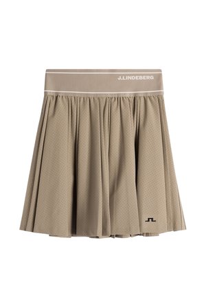 Beiger Faltenrock mit kleinen Perforationen, breitem Bund mit der Aufschrift "J.LINDEBERG" und kleinem schwarzem Logo nahe dem Saum.
