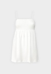 Robe blanche avec des fines bretelles, en tissu texturé, taille empire et jupe fluide arrivant aux genoux. Design minimaliste, sans motifs ni accents.
