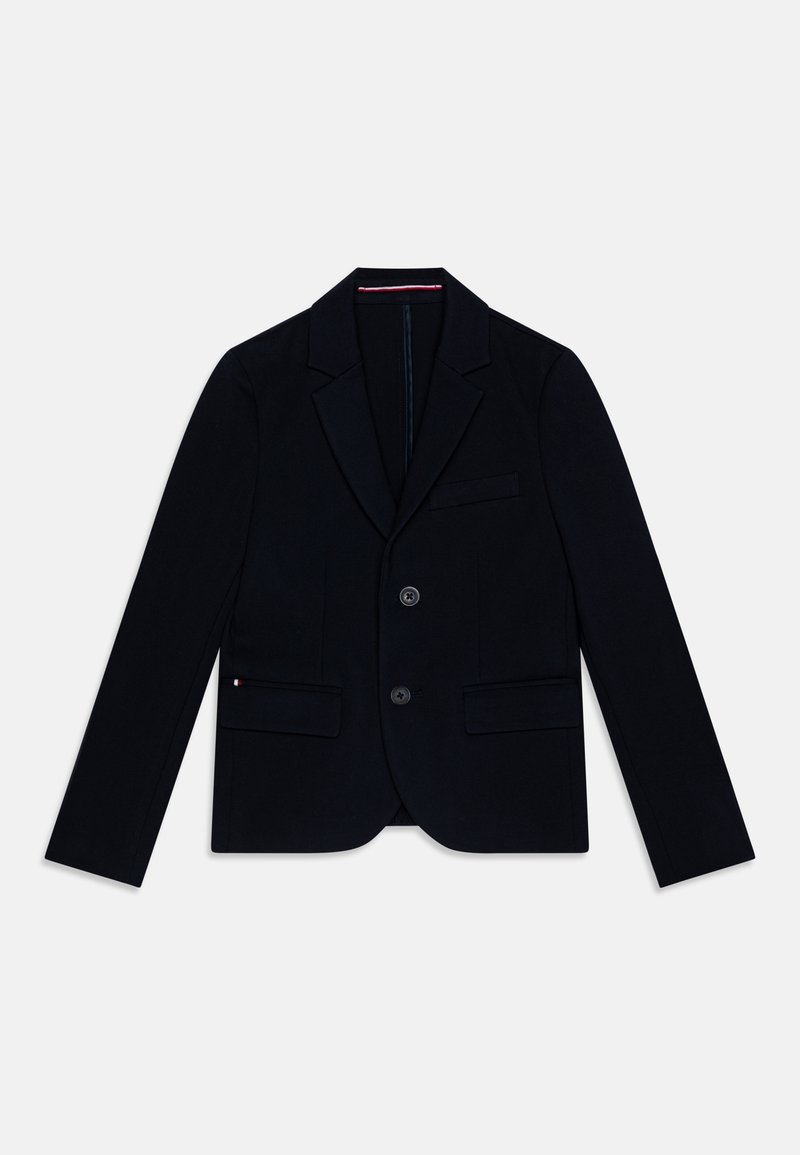 Námořnický blejzr z elastického materiálu s klopami, na dvě knoflíky a předními kapsami. Obsahuje decentní švy a hladkou texturu.