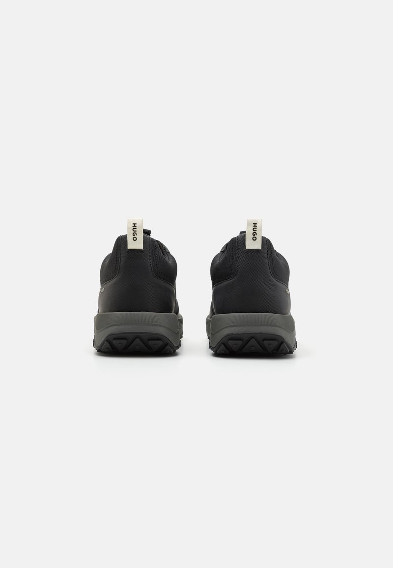 HUGO Kane Runn sneakers in black with red sole