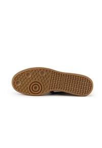 Brown rubber outsole with circular and textured patterns; features the brand name "MUNICH" embossed on the side.