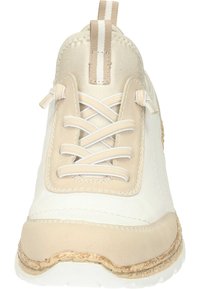 Beige and white sneaker with a smooth leather and suede upper, feature laces, a textured sole, and a stitched seam along the edge.