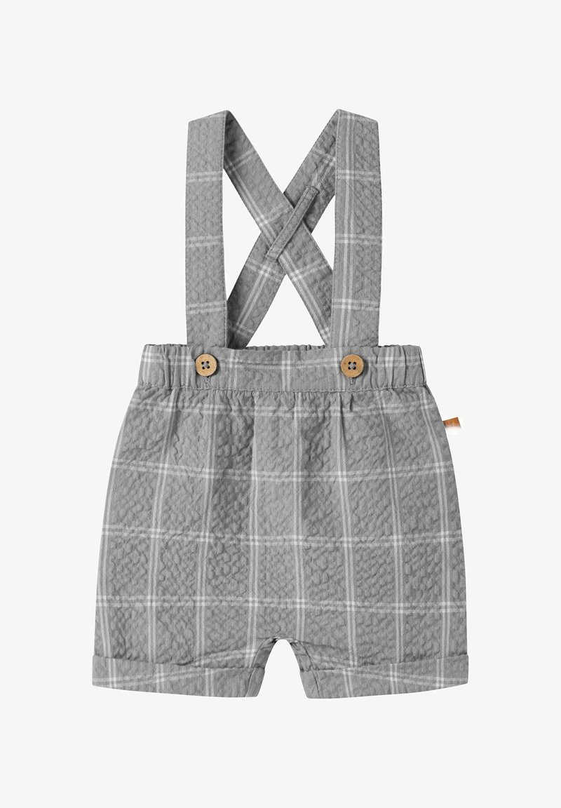 Shorts gris pour tout-petit avec taille élastique et bretelles croisées, présentant un motif à carreaux subtil et des détails en boutons en bois.