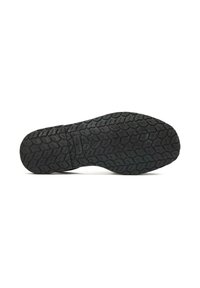 Black rubber shoe sole with a textured tread pattern, featuring raised wavy lines and grooves for traction. Unadorned, minimal design.