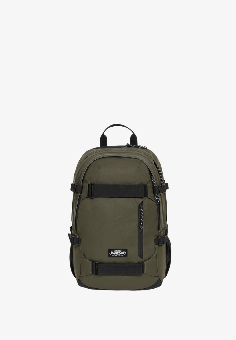 Oliwkowy plecak z regulowanymi paskami, czarnymi akcentami, wieloma zamykanymi na zamek kieszeniami i wyściełanym panelem pleców dla komfortu.