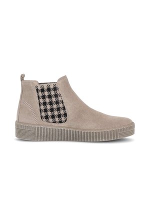 Beigefarbene Wildleder-Stiefelette mit schwarz-weißem Hahnentritt-Gummieinsatz an der Seite, flacher gerippter Sohle und Fersenschlaufe.