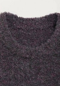Close-up of a dark purple, fuzzy knit sweater neckline with a soft, textured wool fabric.