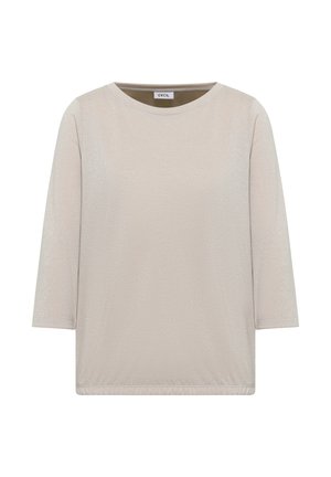 Haut beige clair avec des manches trois quarts, un col rond et une texture subtile. Équipé d'une taille élastique pour un ajustement décontracté. Sans motifs ni accents.