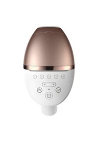 Dispositivo facciale bianco con forma arrotondata, cappuccio metallico color oro rosa e un pannello di controllo con pulsanti e simbolo di accensione.