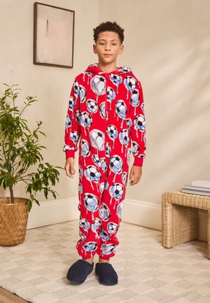 Roter Overall mit Kapuze, verziert mit einem Muster aus Fußbällen. Hergestellt aus weichem Stoff, verfügt er über elastische Bündchen und einen Reißverschluss an der Vorderseite.
