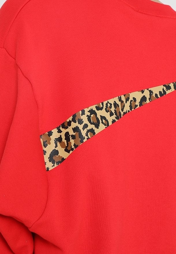 red nike sweatshirt with leopard swoosh