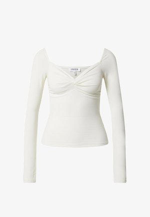 Weißes Langarmoberteil aus geripptem Stoff, mit quadratischem Ausschnitt und geknotetem Frontdetail. Figurbetonte Silhouette, minimalistisches Design.