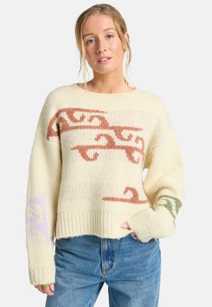 Cremefarbener gestrickter Pullover mit abstrakten Mustern in Hellbraun, Lila und Grün. Hat eine lockere Passform sowie gerippte Säume und Bündchen.
