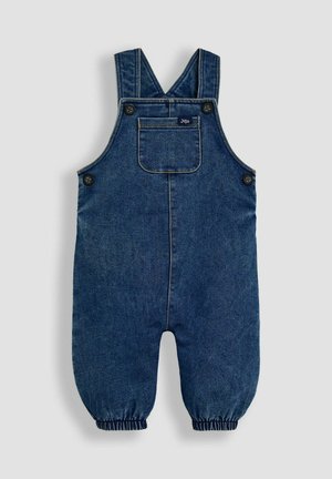 Tumed värvi denim üleüldised riided reguleeritavate õlapaeltega, kahe esikoti, elastsete mansettide ja kollase õmbluse detailiga.