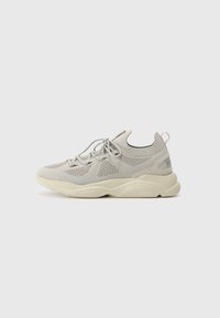 Gray athletic shoe with mesh upper and tonal laces. Features a rounded toe, thick cream-colored sole, and subtle branding on heel.