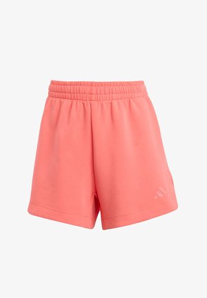 Coral athletic shorts made of soft fabric, featuring an elastic waistband and side pockets. Includes a subtle logo on the lower leg.